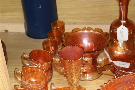 A pair of Carnival glass crucifix candlesticks and a collection of other marigold Carnival glass,